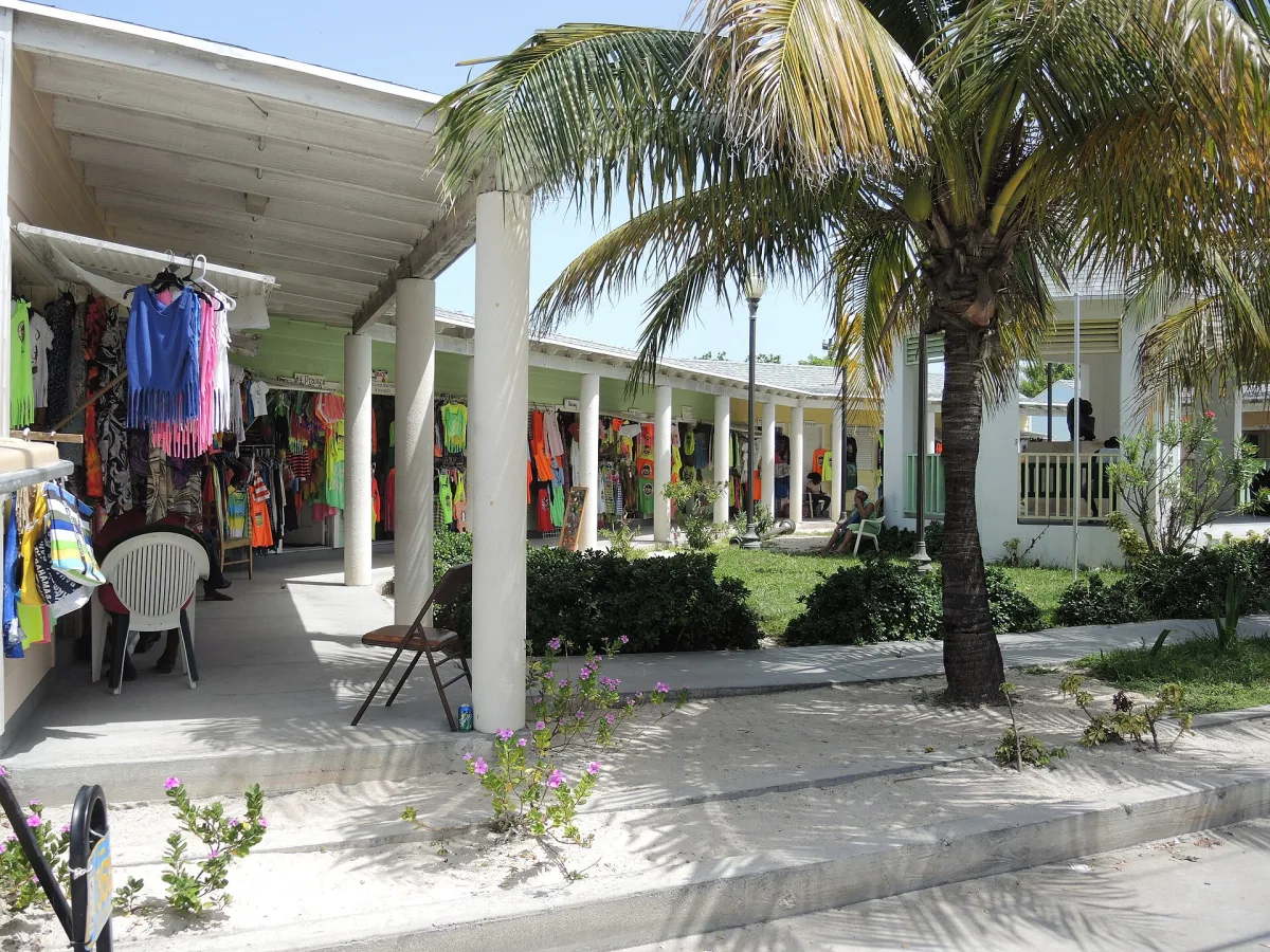 Shops and stalls under palm trees in Alice Town, North Bimini