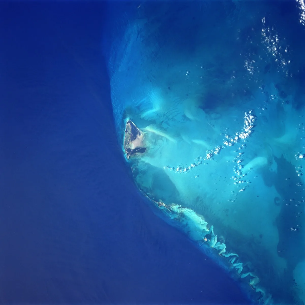 Aerial view of North and South Bimini in the Bahamas, showing the narrow islands ringed by turquoise water